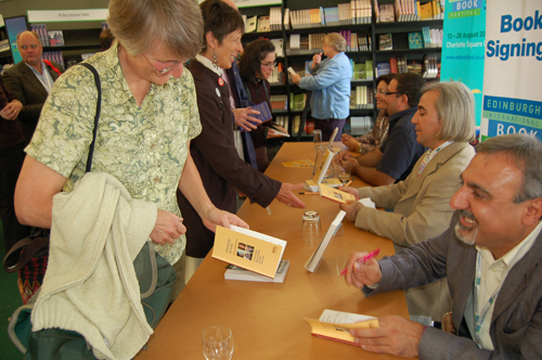 Authors signing the tour's book
