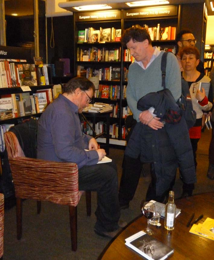 Sinan signing copies of The Corpse Washer