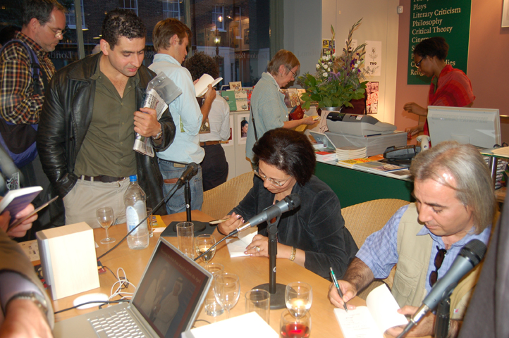 Authors signing the tour's book 